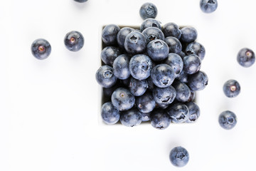 Fresh blueberries in a white plate