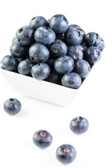 Fresh blueberries in a white plate