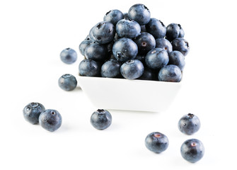 Fresh blueberries in a white plate