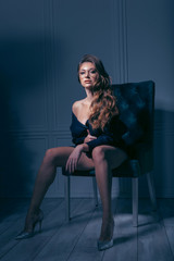 Naklejka premium sensual woman in a chair