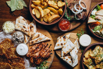 delicious European and Slavic cuisine on the big table waiting for guests. table with food, top view