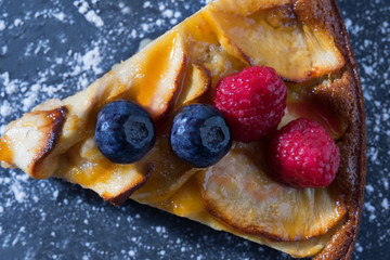 Portion of apple pie on a slate surface. Top view, Macro focus. Dessert concept.