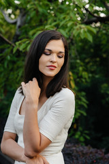 The girl walks in nature and poses. Lifestyle