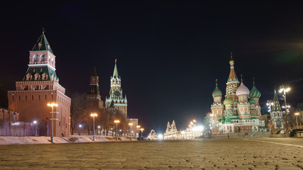 Moscow, Russia - March 9, 2019: Red Square. Spring night. Spasskaya Tower, Red Kremlin wall, Saint Basil's Cathedral / Cathedral of Vasily the Blessed, facade of GUM (department store). Stone pavement