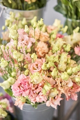 Bunches of flowers different varieties eustoma in vases. Lovely Vintage background with flowers. Wallpapers
