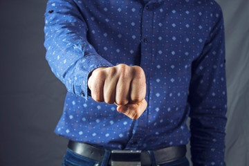 man shows fists