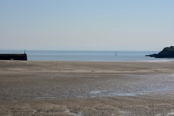 BARRY, VALE OF GLAMORGAN / WALES - APRIL 15 2020: elderly people take daily exercise in the sunshine during the COVID_19 lockdown making sure they are complying with social distance rules