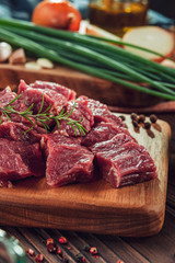 Cutted raw beef rump tail with ingredients - In close-up