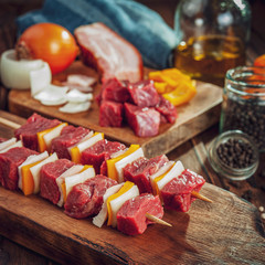 Raw meat stick with ingredients - Brazilian espetinho de carne