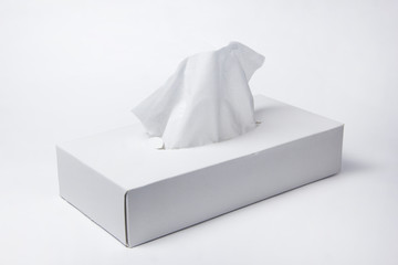 Napkins in a box on a white background. Box for napkins. Natural material.