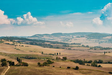 view of Tuscan fields and hills in Italy