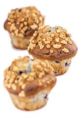 Some Blueberry Muffins isolated on white (selective focus)
