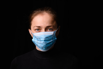 Female Medical Worker Wearing Protective Face Mask. Covid-19 protection.