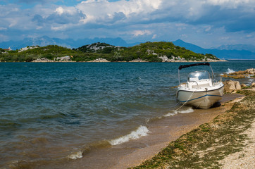 Fototapeta na wymiar New tourist boat on the lake skarda, Montenegro