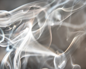 Copper brown abstract background - Trail of smoke on a dark background - creative colour effects with smoke smudges