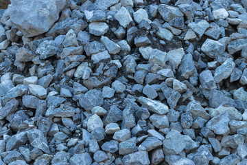 Close up of rough gray gravel made of pebbles