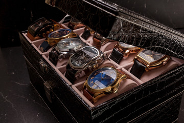 storage box with collection of men wrist watches