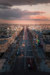 Fototapeta premium Champs-Elysees, main avenue at Paris, France seen from the top roof view of the Arc de Triomphe (Triumphal Arch).