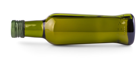 lying on the side green bottle with olive oil on white