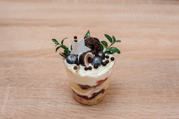 A beautiful and mouth-watering close-up trifle on a table with space for a signature. Cake
