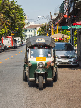 Traditional Thai Tuc Tuc Taxi on Empty Road. Three Wheel Mini Car.