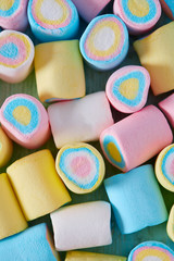 сolorful marshmallow on wooden surface