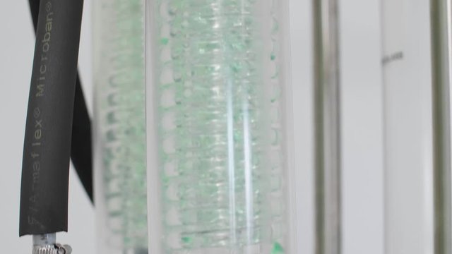 Close up of rotational vaporiser with green condenser during CBDa oil extraction