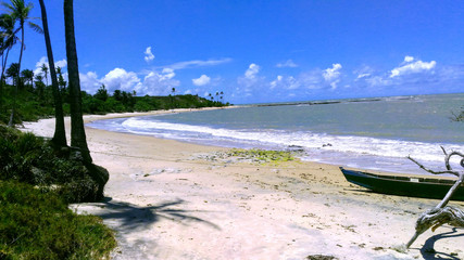 Fototapeta premium Beach with canoe on the sand.