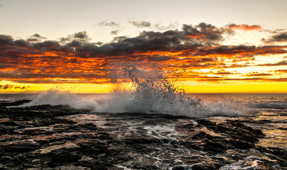 Fototapeta na wymiar Sunset at Pele's Well on The Kona Coast Of The Big Island of Hawaii, Hawaii, USA