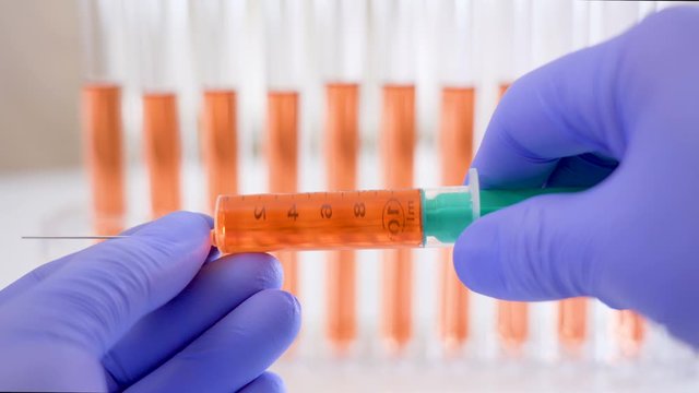 A 10ml fluid inside the big syringe in the lab