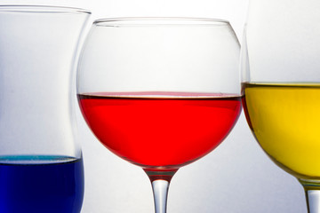 Colored liquid in glassware of primary colors