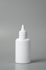 Medical antiseptic and hygiene products, hand sanitizer are used to kill germs, bacteria and viruses, as well as protective masks. Composition on a gray background.