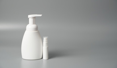 Medical antiseptic and hygiene products, hand sanitizer are used to kill germs, bacteria and viruses, as well as protective masks. Composition on a gray background.