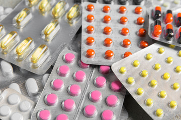 Colorful pills in blister packs . Medicines, pharmacy, health. Pharmaceutical industry.