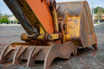 Construction excavator bucket on work site