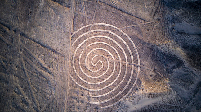 Aerial top down view on "the Circle" one of the Nazca lines. Mysterious lines and geoglyphs at Nazca desert.