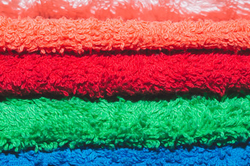 Heap of different colorful towels close up