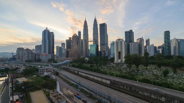 Time lapse: Kuala Lumpur city view during sunrise overlooking a city skyline