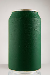 Green chilled can of soda with drops on white background and drop, in front view