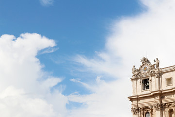 Fototapeta na wymiar Oltramontano Clock on St. Peter's Basilica with dramatic sky in Vatican City, Rome, Italy