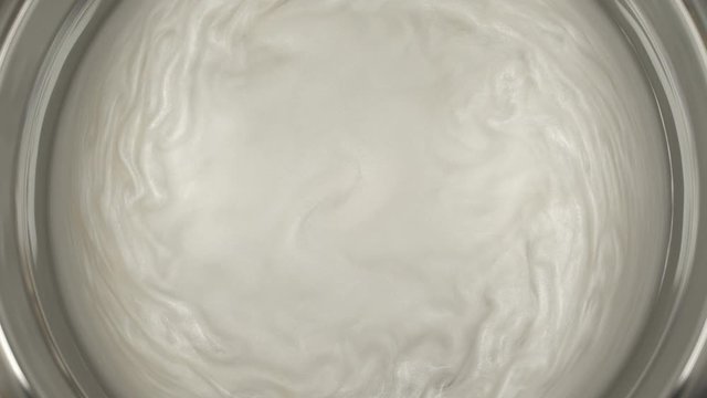 Rheoscopic fluid. Beautiful movement of particles in a liquid. Fantastic patterns and shapes.
