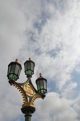 Lamppost on Westminster Bridge with the blue sky and clouds, London, UK