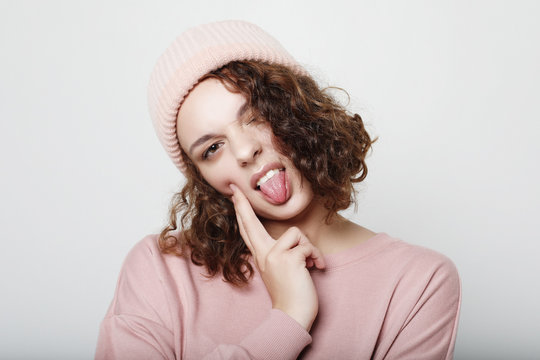 Lifestyle and people concept: Young cute hipster girl wearing pink