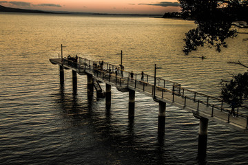 Fototapeta premium The various way to enjoy the sunset from a wharf.