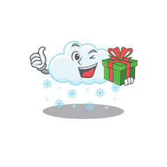 Smiling snowy cloud cartoon character having a green gift box