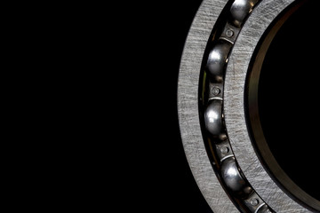 Closeup of Steel Roller bearings on black background..