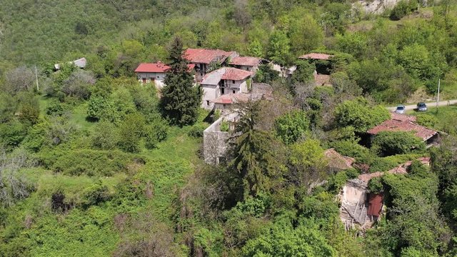 Aerial Drone Shot Of Abandoned Houses In Slapnik Village, Korada Hills Slovenia