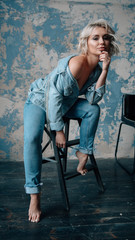Fashion portrait of beautiful girl in jeans wear