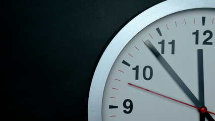 Countdown clock Twelve o'clock White wall clock on black background, Concept It is 100 Seconds to...