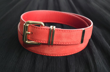 rounded red designers belt with gold buckle